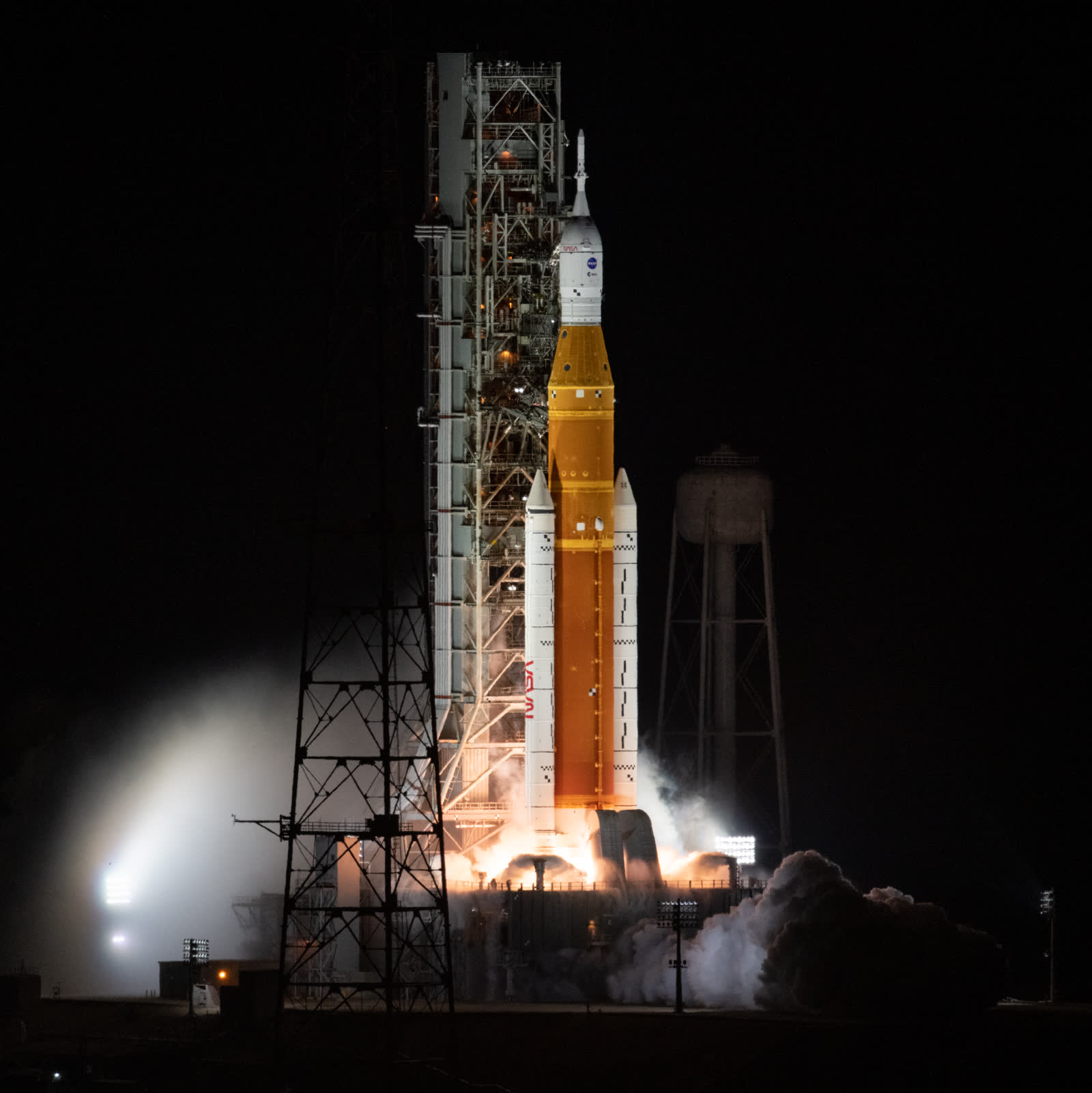 NASA's Space Launch System rocket launching Artemis I at night