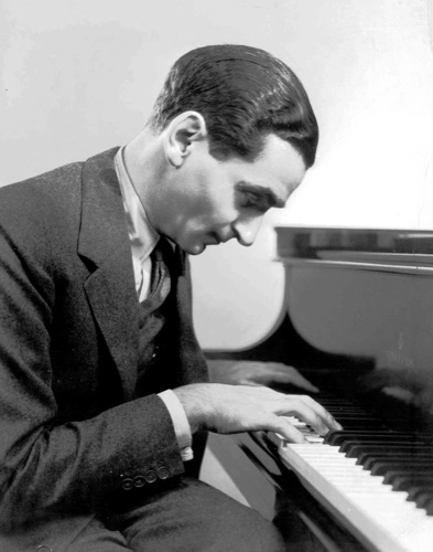 Irving Berlin at a piano, photographed in 1937