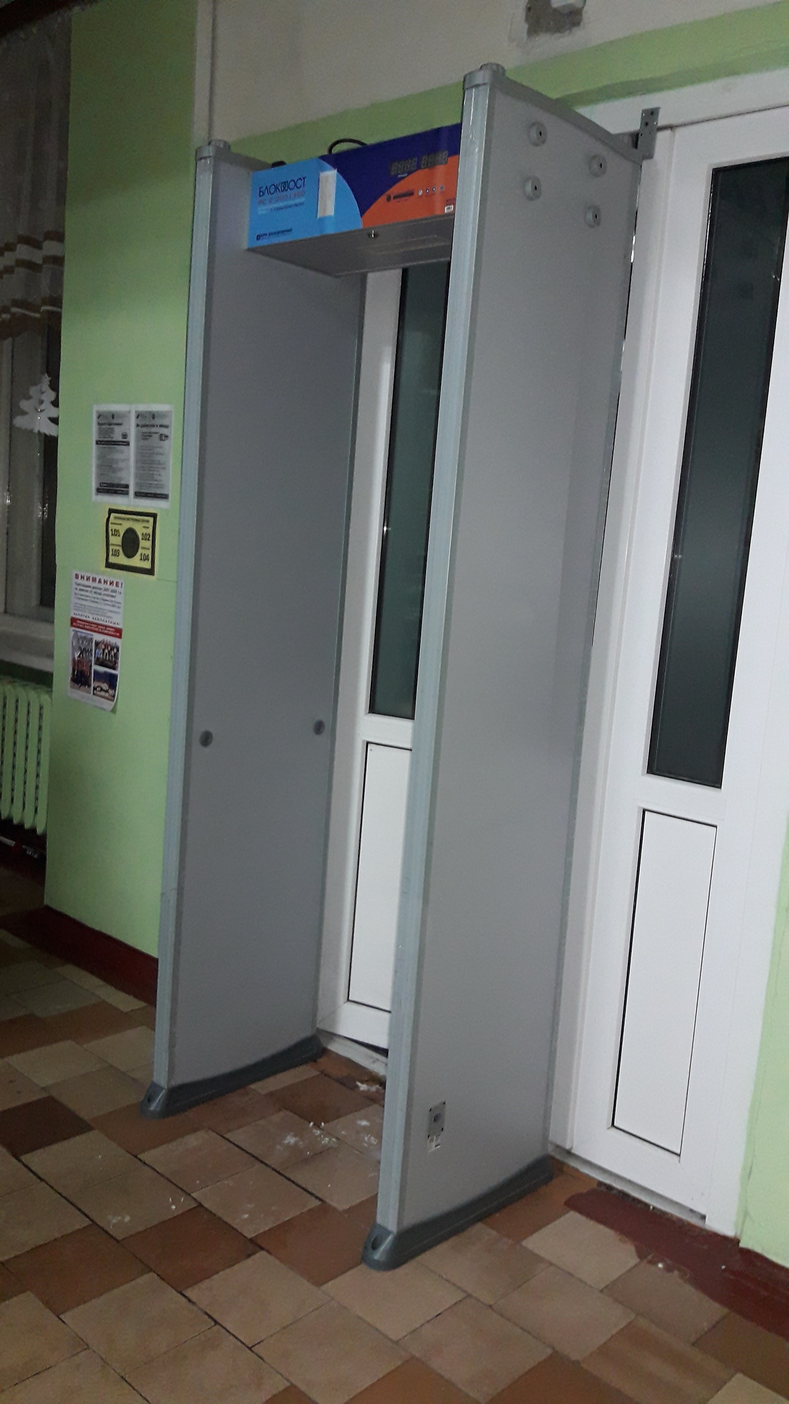 A walk-through metal detector installed at a school entrance